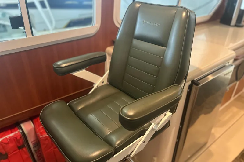 Slide: The Image of Luxurious leather chair in 2007 True North 38 Heritage yacht interior. - 17