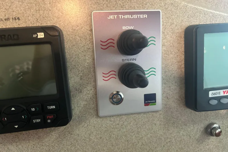 Slide: The Image of Control panel of a 2007 True North 38 Heritage boat with jet thruster controls. - 23