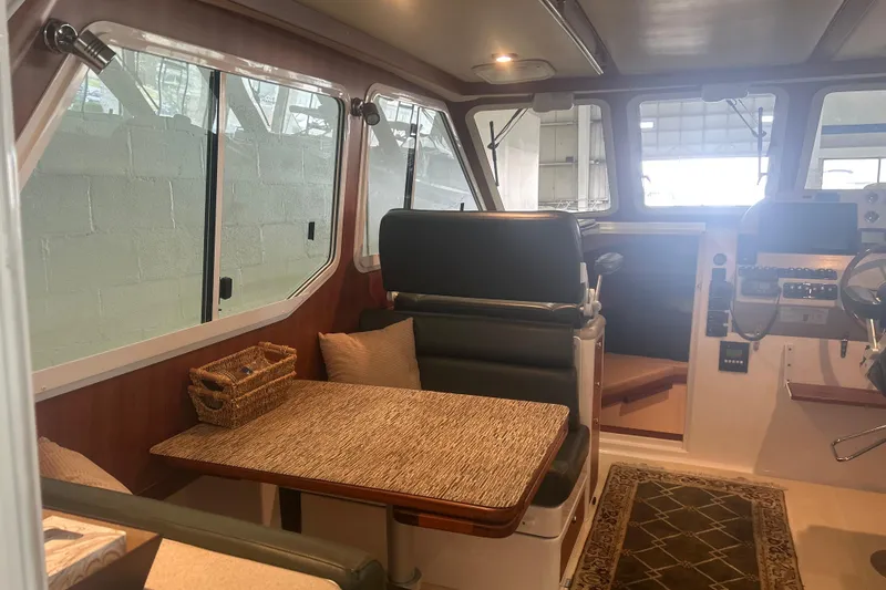 Slide: The Image of Interior of 2007 True North 38 Heritage boat with seating and helm station. - 33