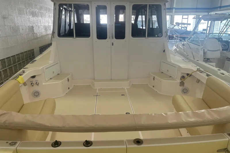 Slide: The Image of 2007 True North 38 Heritage boat interior with beige seating and spacious deck. - 34