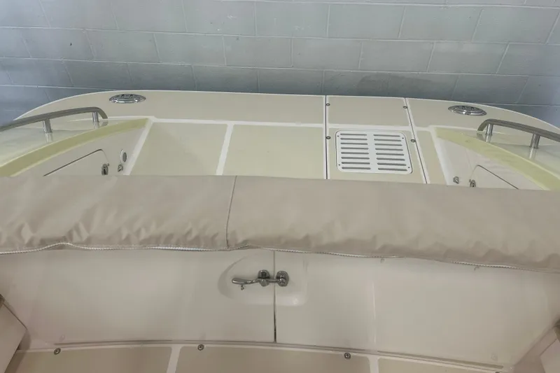 Slide: The Image of 2007 True North 38 Heritage boat interior with beige seating and storage compartments. - 39