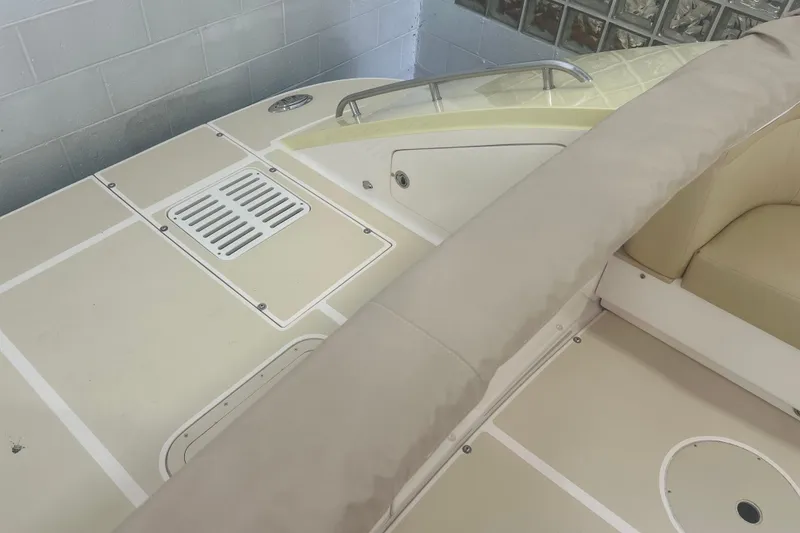 Slide: The Image of 2007 True North 38 Heritage boat deck with beige seating and storage compartments. - 40