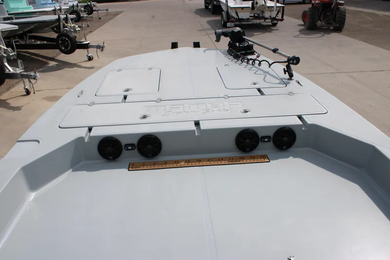 Slide: The Image of 2025 Mamba 24 Cat Elite boat deck with storage compartments and trolling motor. - 10