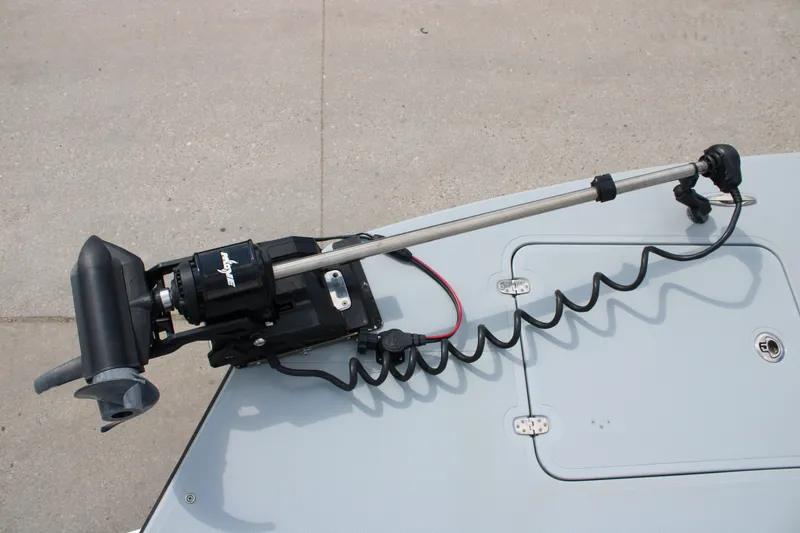 Slide: The Image of Trolling motor mounted on a 2025 Mamba 24 Cat Elite boat deck. - 11