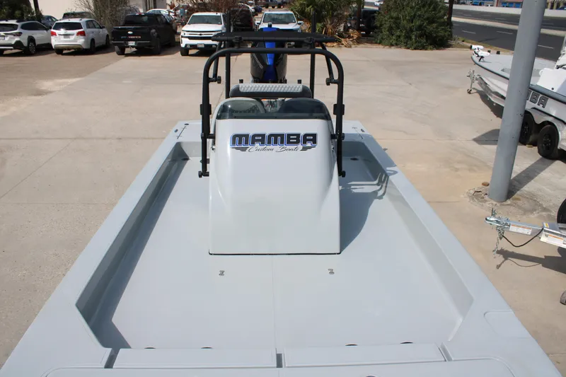 Slide: The Image of 2025 Mamba 24 Cat Elite boat on display in a parking lot. - 12