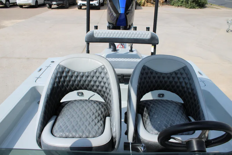 Slide: The Image of 2025 Mamba 24 Cat Elite boat interior with diamond-stitched seats and steering wheel. - 13