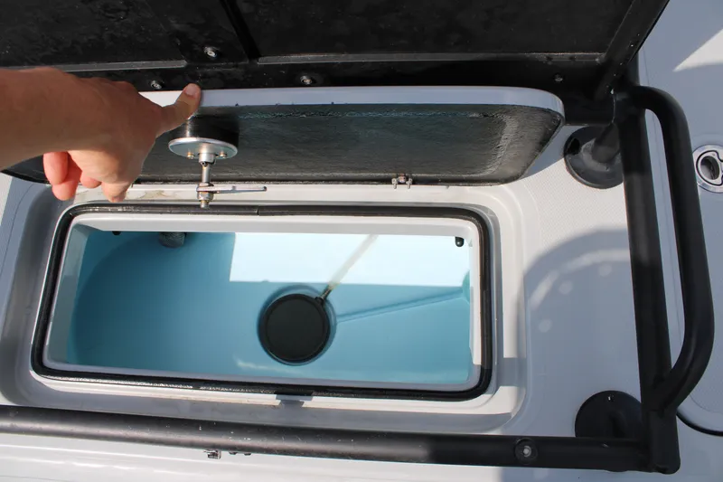 Slide: The Image of Open hatch of 2025 Mamba 24 Cat Elite boat, showcasing interior compartment. - 15