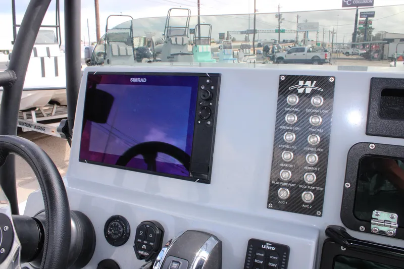 Slide: The Image of Dashboard of 2025 Mamba 24 Cat Elite boat with Simrad display and control panel. - 19