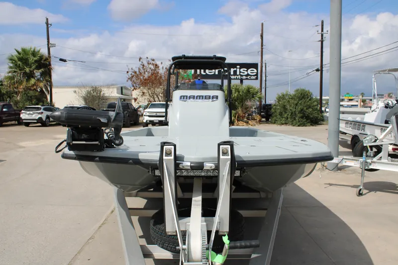The Image of 2025 Mamba 24 Cat Elite boat on trailer in outdoor dealership lot. - 2