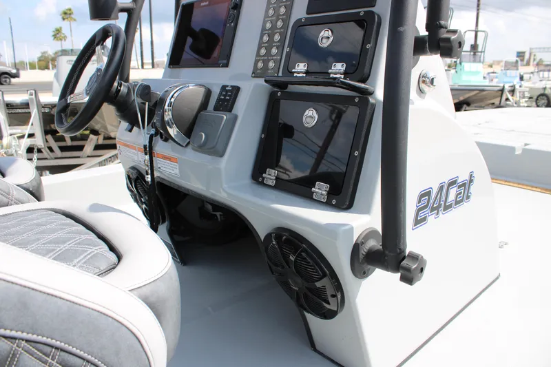 Slide: The Image of 2025 Mamba 24 Cat Elite boat console with steering wheel and control panel. - 20