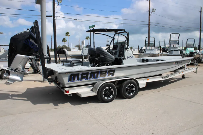 Slide: The Image of 2025 Mamba 24 Cat Elite boat on trailer, featuring powerful outboard motor. - 4