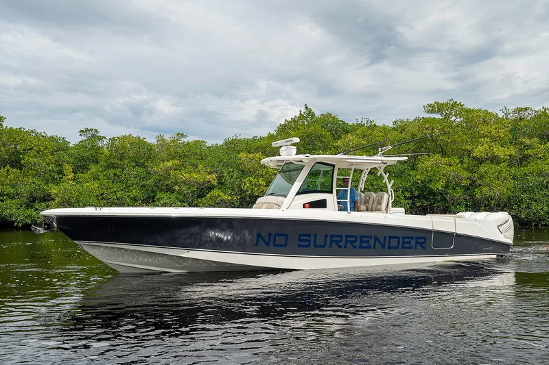 Slide: The Image of 2017 Boston Whaler 370 Outrage boat named "No Surrender" on calm water. - 12