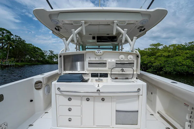Slide: The Image of 2017 Boston Whaler 370 Outrage boat interior with fishing station and storage. - 25