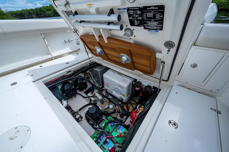 Slide: The Image of 2017 Boston Whaler 370 Outrage engine compartment, showcasing detailed mechanical components. - 32