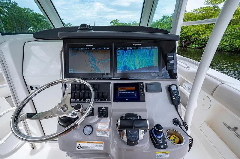 Slide: The Image of 2017 Boston Whaler 370 Outrage helm with advanced navigation displays and controls. - 35
