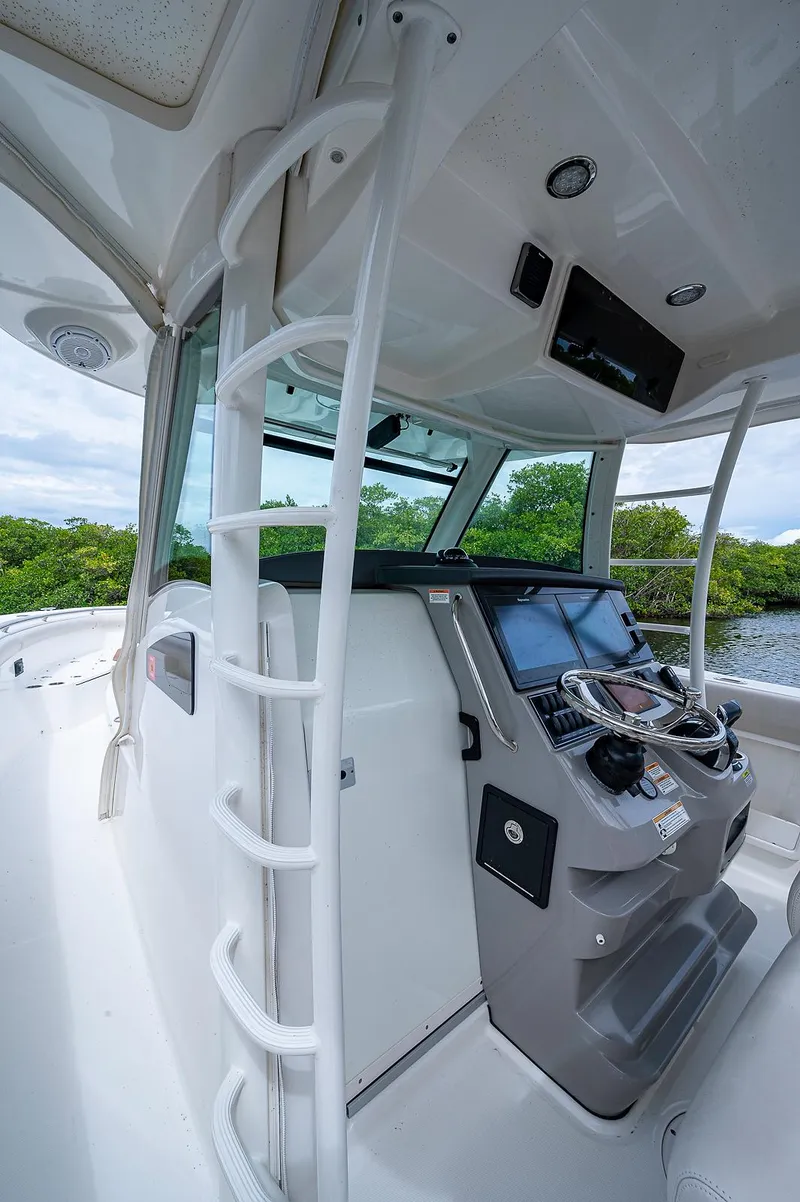 Slide: The Image of 2017 Boston Whaler 370 Outrage helm with advanced navigation system and sleek design. - 37