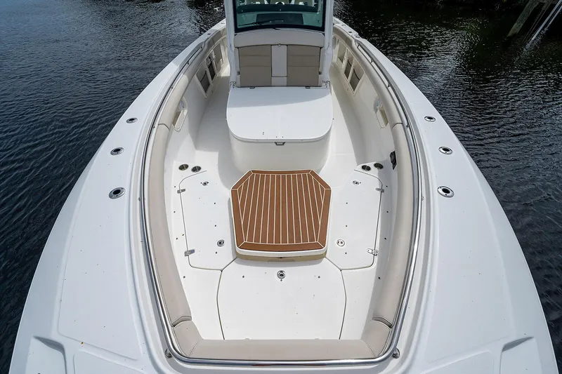 Slide: The Image of 2017 Boston Whaler 370 Outrage boat deck with seating and wood accents. - 46