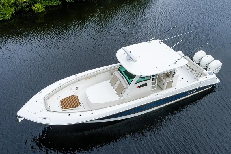 Slide: The Image of 2017 Boston Whaler 370 Outrage boat on calm water. - 5