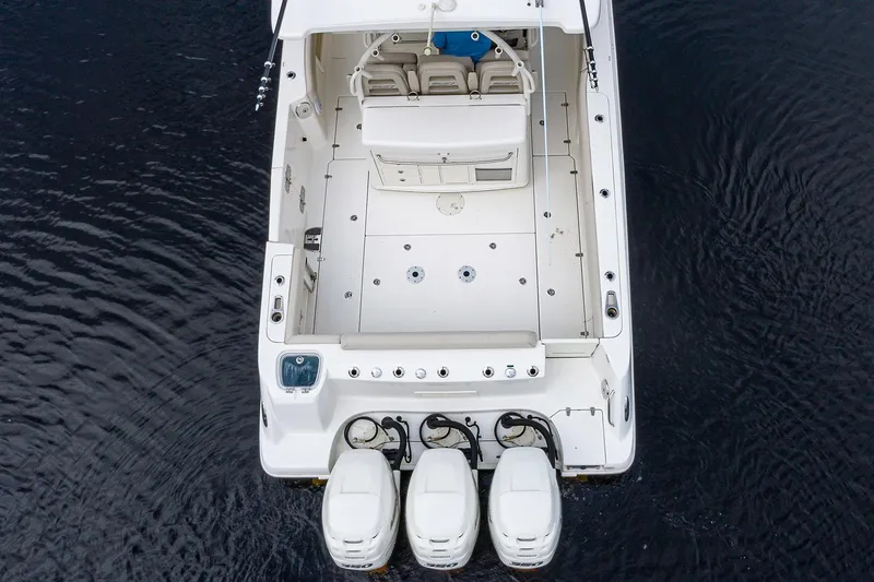 Slide: The Image of 2017 Boston Whaler 370 Outrage boat with triple engines, aerial view. - 9