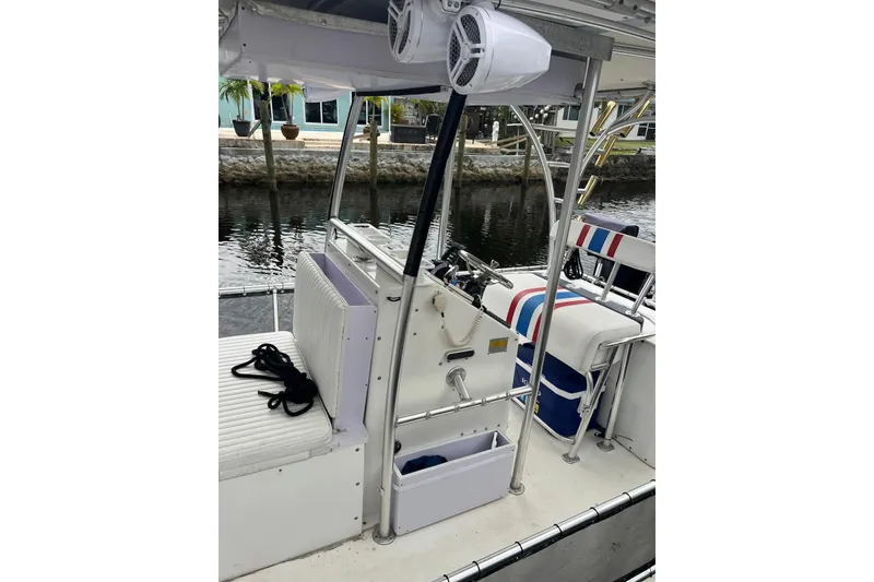 Slide: The Image of 2010 A&M Manufacturing Triton Pontoon boat interior with seating and speakers. - 7