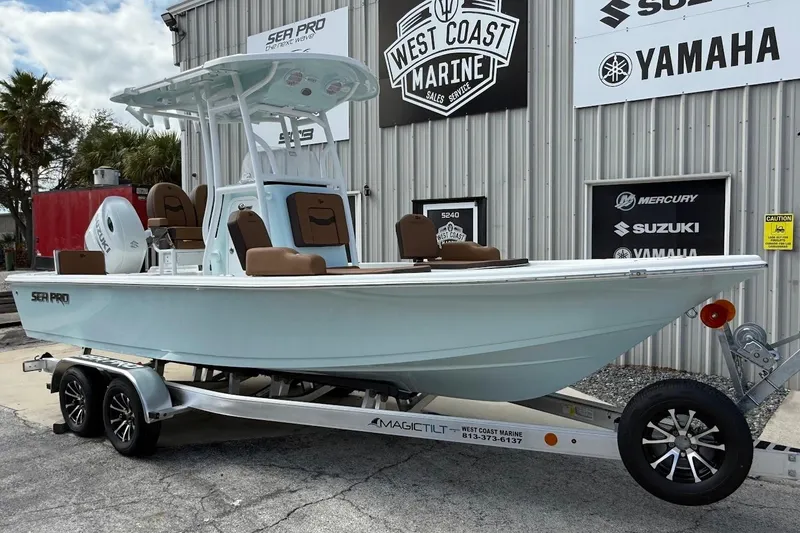 The Image of 2026 Sea Pro 230 Bay boat on trailer at West Coast Marine dealership. - 1