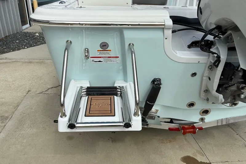Slide: The Image of 2026 Sea Pro 230 Bay boat with swim platform and ladder, rear view. - 14
