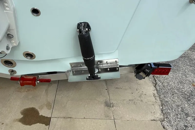 Slide: The Image of 2026 Sea Pro 230 Bay boat transom with trim tab and hydraulic system. - 15