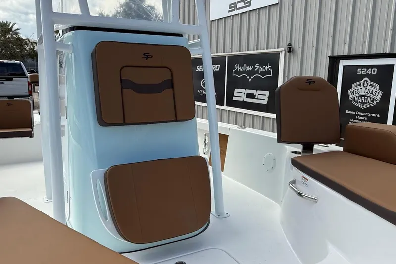 Slide: The Image of 2026 Sea Pro 230 Bay boat interior with brown seating and storage compartments. - 17