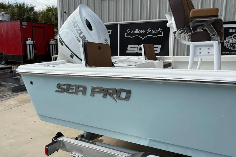 Slide: The Image of 2026 Sea Pro 230 Bay boat with Suzuki engine, displayed outdoors. - 8