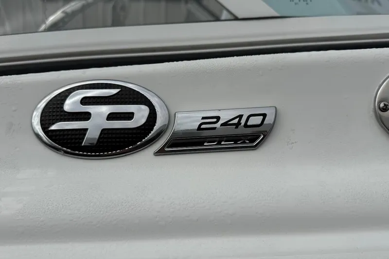 Slide: The Image of 2026 Sea Pro 240 Dual Console logo on boat exterior. - 13