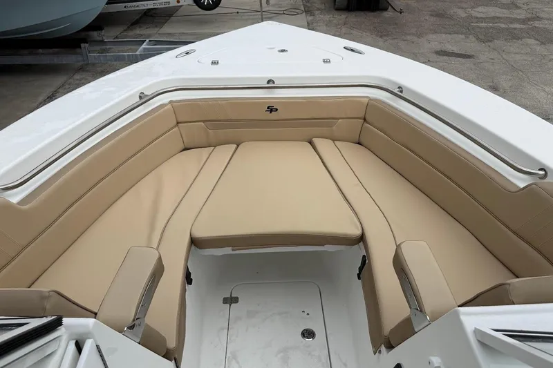 Slide: The Image of 2026 Sea Pro 240 Dual Console boat with tan seating in the bow area. - 17