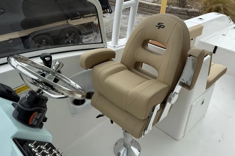 Slide: The Image of Captain's chair and steering wheel of 2026 Sea Pro 240 Dual Console boat. - 18