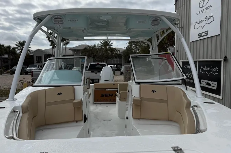 Slide: The Image of 2026 Sea Pro 240 Dual Console boat with open seating and sleek design. - 3