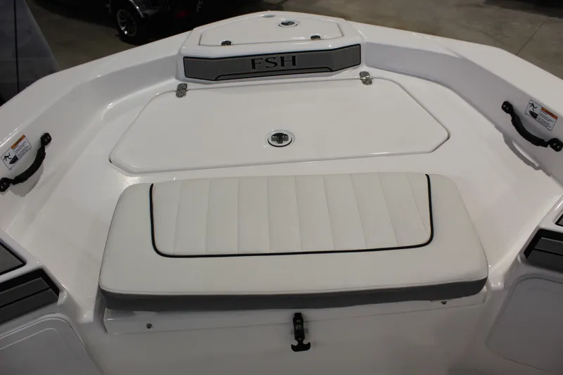 Slide: The Image of 2026 Yamaha Boats 195 FSH Sport bow seating and storage area. - 12