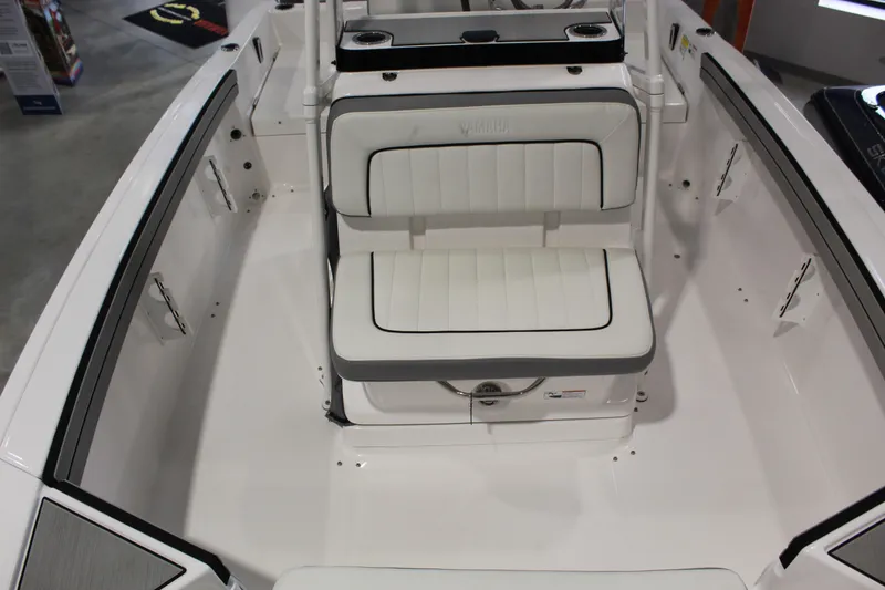 Slide: The Image of 2026 Yamaha Boats 195 FSH Sport interior with white seating and sleek design. - 13
