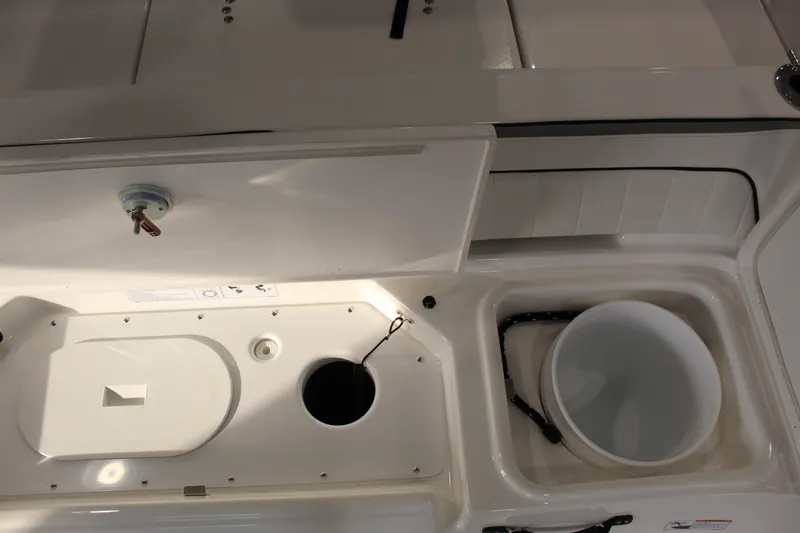 Slide: The Image of 2026 Yamaha Boats 195 FSH Sport interior storage compartments and features. - 3