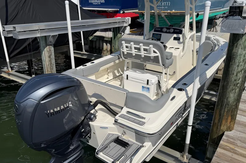 Slide: The Image of 2026 Pioneer 202 Islander boat with Yamaha engine docked at marina. - 17