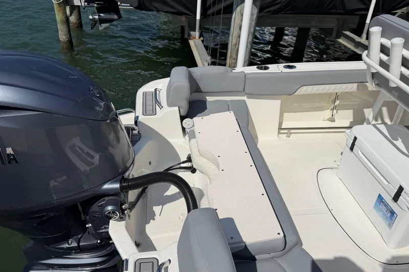 Slide: The Image of 2026 Pioneer 202 Islander boat interior with engine and seating area. - 19