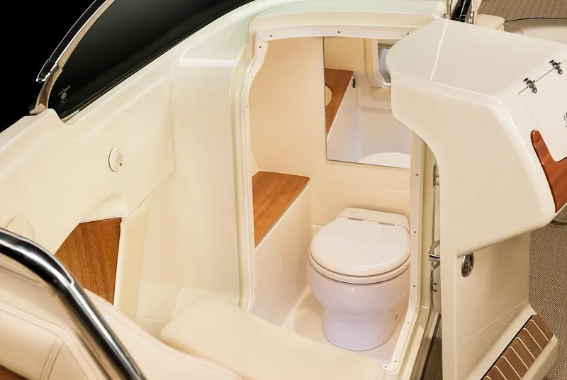Slide: The Image of Manufacturer Provided Image: 2025 Chris-Craft Launch 28 GT boat interior with compact bathroom and toilet. - 19