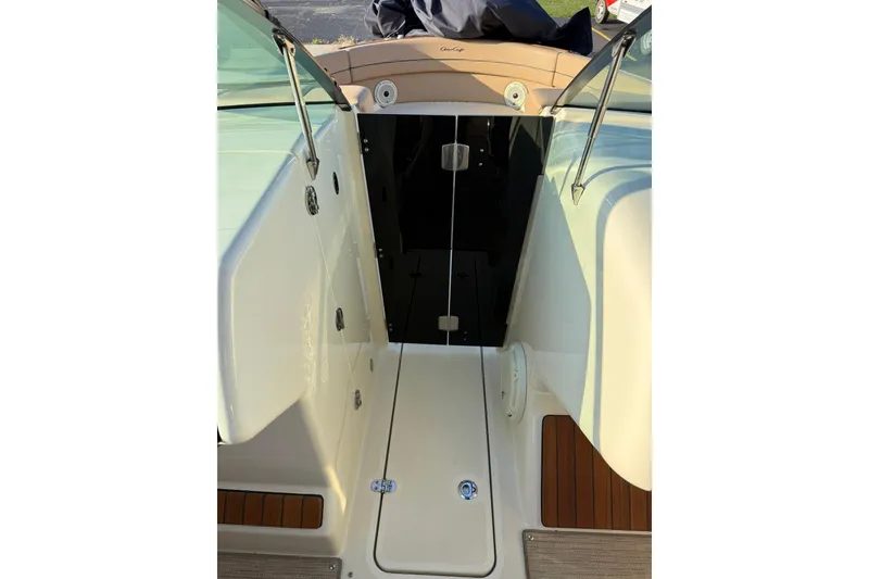Slide: The Image of 2025 Chris-Craft Launch 28 GT boat interior with open cabin door. - 22