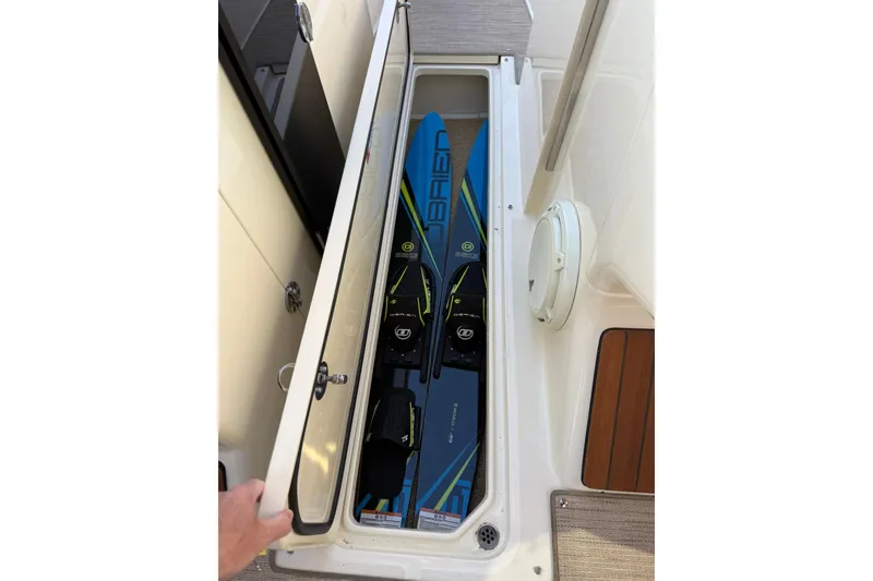 Slide: The Image of Storage compartment on 2025 Chris-Craft Launch 28 GT boat with water skis inside. - 34