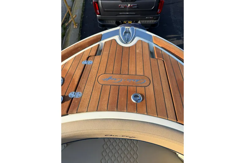 Slide: The Image of 2025 Chris-Craft Launch 28 GT boat with teak deck and elegant design. - 35