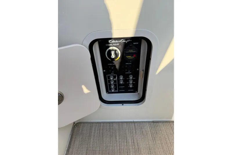 Slide: The Image of Control panel of 2025 Chris-Craft Launch 28 GT boat, featuring various switches and dials. - 37
