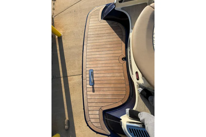 Slide: The Image of 2025 Chris-Craft Launch 28 GT swim platform with teak decking and stainless steel details. - 38