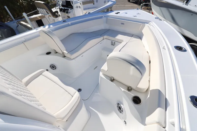 Slide: The Image of 2026 Sea Hunt Ultra 265 SE boat interior with white seating and modern design. - 13