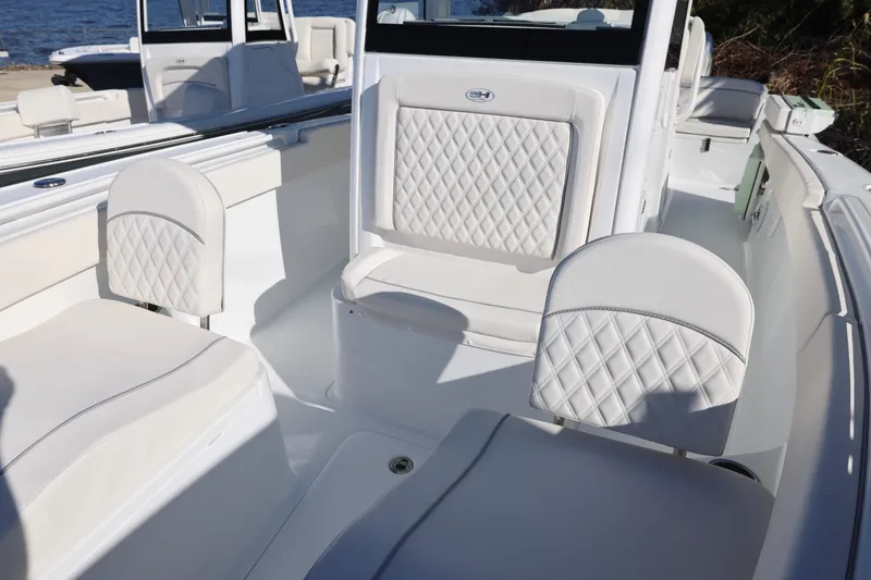 Slide: The Image of Luxurious seating on 2026 Sea Hunt Ultra 265 SE boat, featuring diamond-stitched upholstery. - 15