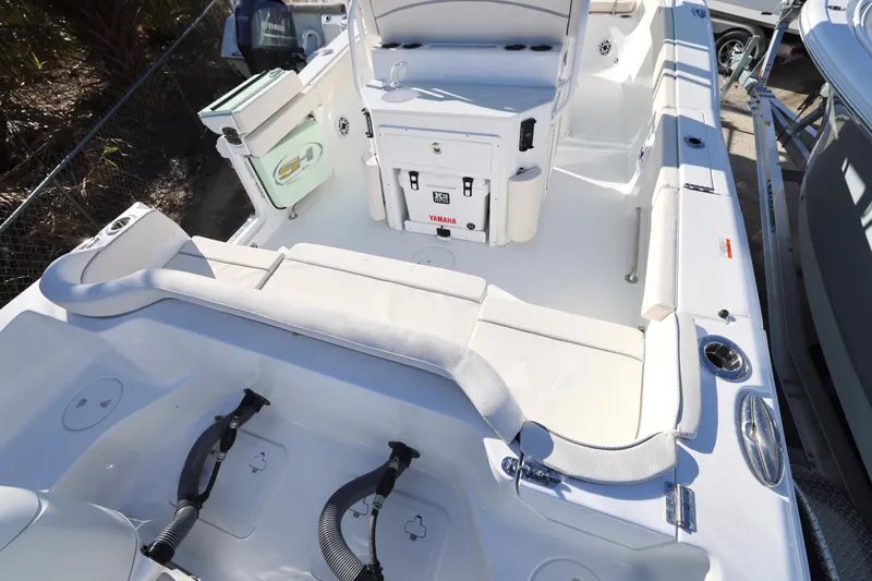 Slide: The Image of 2026 Sea Hunt Ultra 265 SE boat interior with seating and storage compartments. - 16
