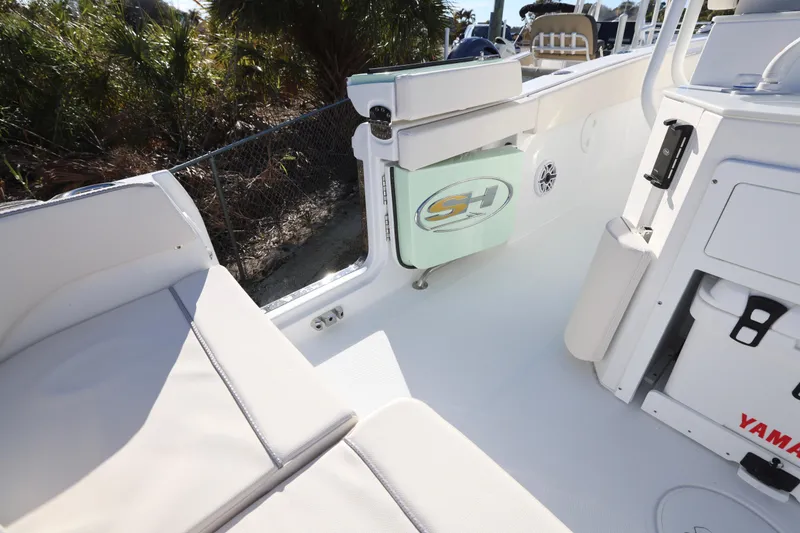 Slide: The Image of 2026 Sea Hunt Ultra 265 SE boat interior with seating and storage features. - 17