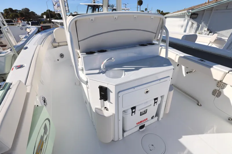 Slide: The Image of 2026 Sea Hunt Ultra 265 SE boat interior with Yamaha cooler and storage area. - 19