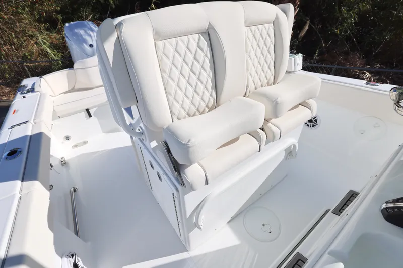 Slide: The Image of 2026 Sea Hunt Ultra 265 SE boat with luxurious white seating and modern design. - 21